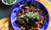 Braised  Oxtail  with  Cannellini  Beans  and  Cherries  with  Cilantro  Gremolata